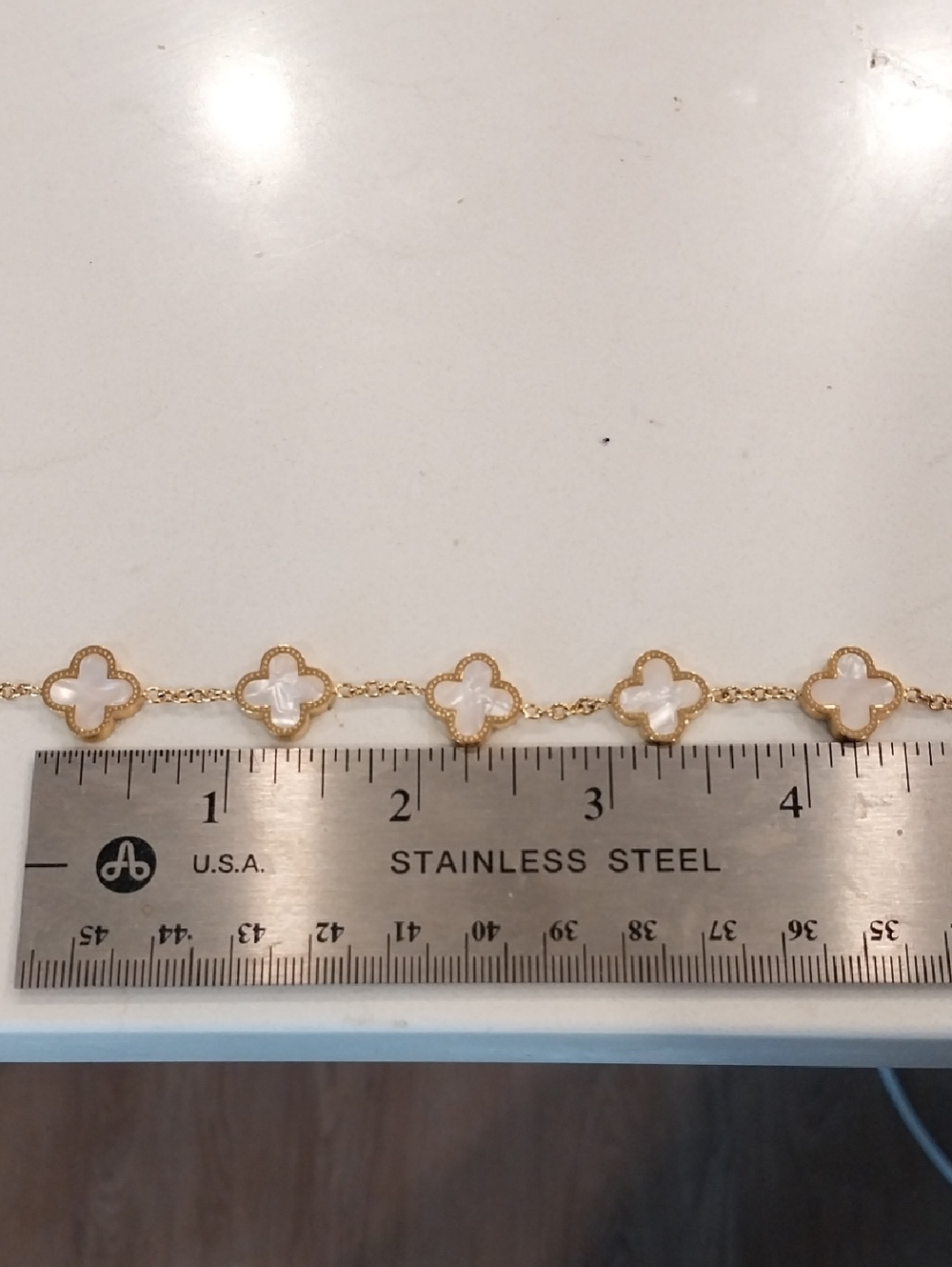 White Clover Bracelet On Stainless Steel Chain.
